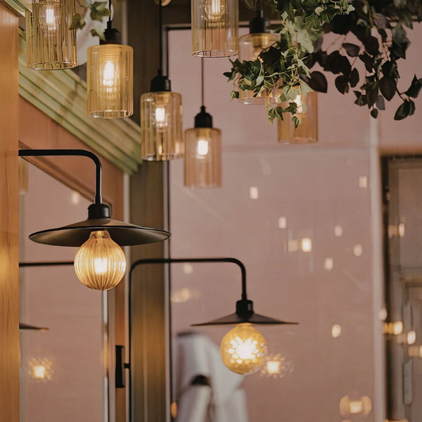 Decorative lighting fixtures in a warm indoor setting